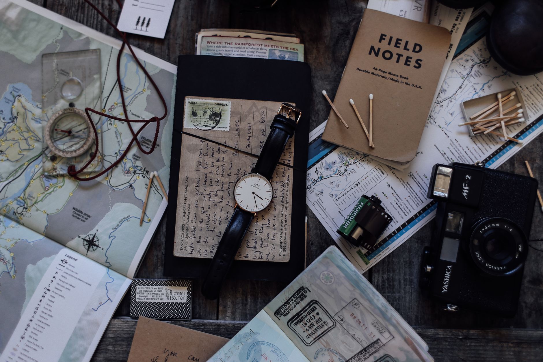 Customized map and journal notebook on rustic table